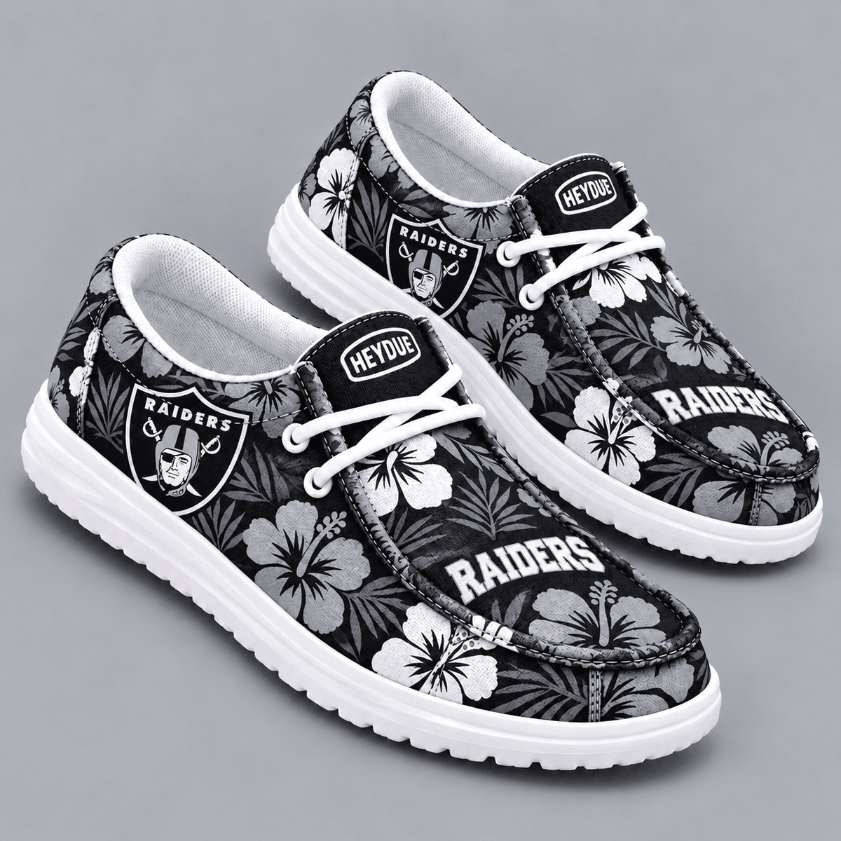 Las Vegas Raiders | Premium NFL Tropical Hibiscus Floral Print HEYDUDE Casual Loafers With Team Logo And Lightweight Comfort Sole NDN cover