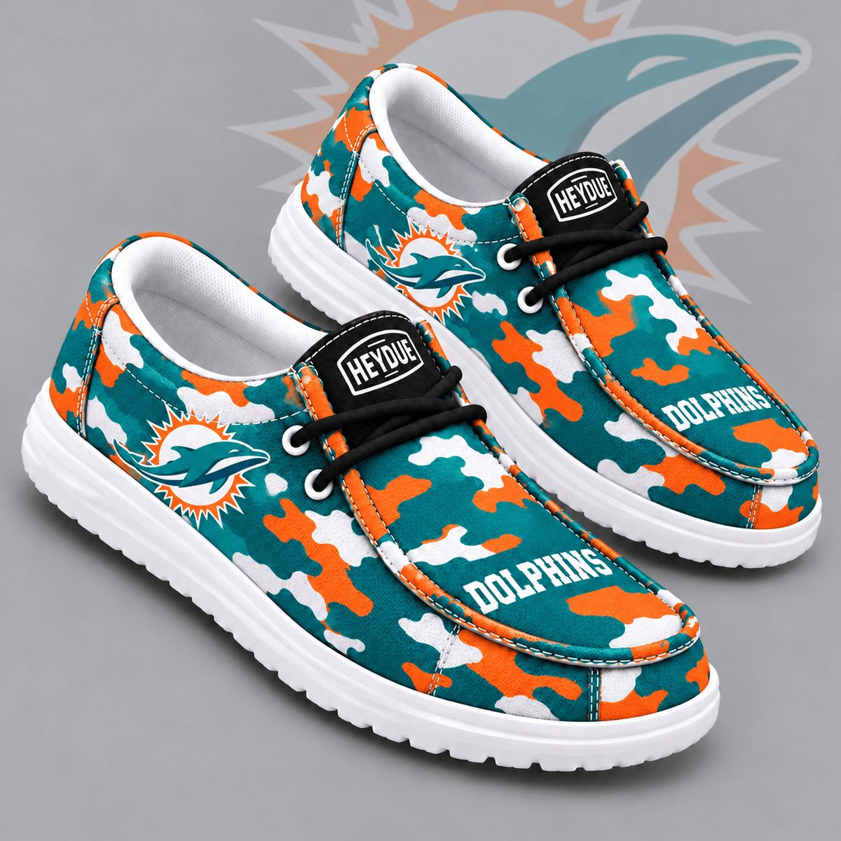 Miami Dolphins | Premium NFL Urban Camo Print HEYDUDE Casual Loafers With Team Logo And Lightweight Comfort Sole NDN cover