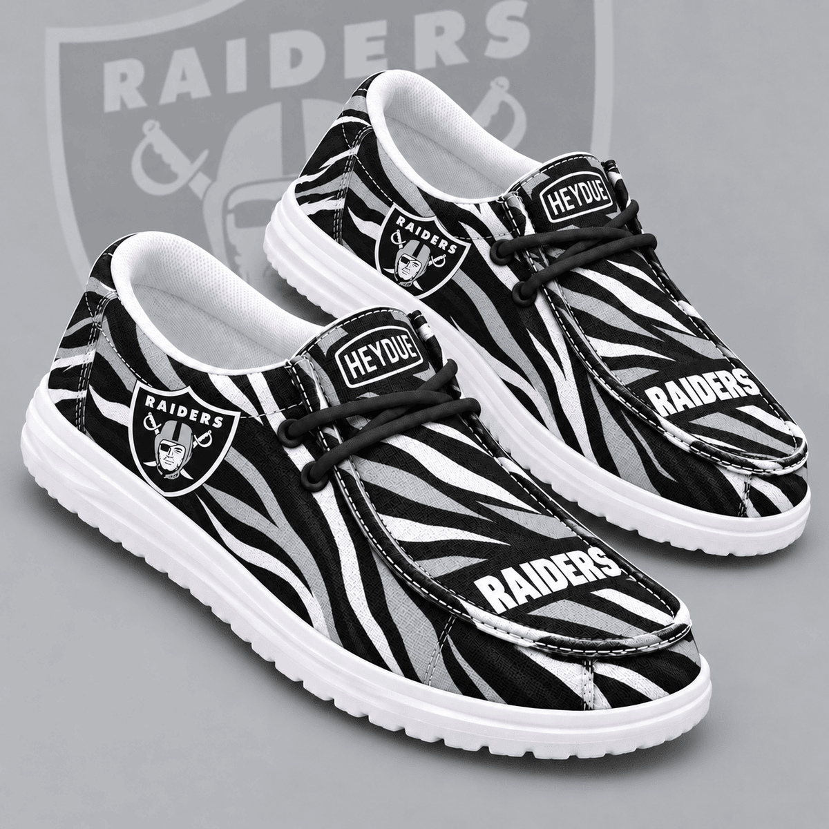 Las Vegas Raiders | Premium NFL Wild Zebra Stripe Print HEYDUDE Casual Loafers With Team Logo And Lightweight Comfort Sole NDN cover