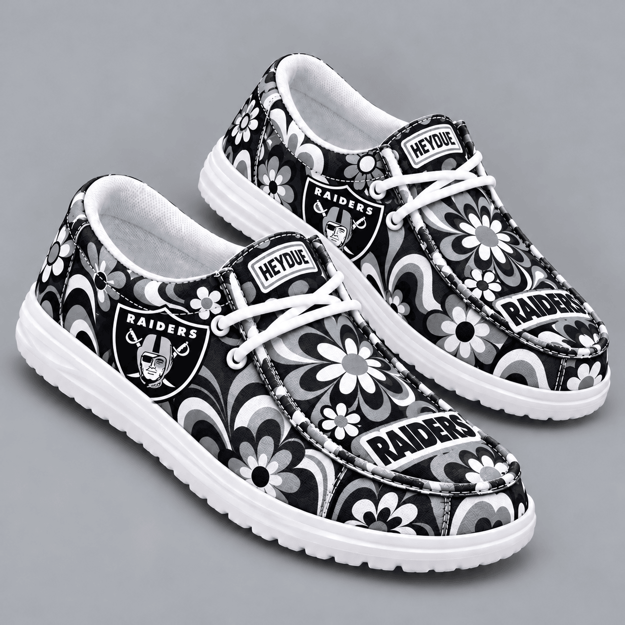 Las Vegas Raiders | Premium NFL Retro Groovy Floral Swirl Print HEYDUDE Casual Loafers With Team Logo And Lightweight Comfort Sole NDN cover