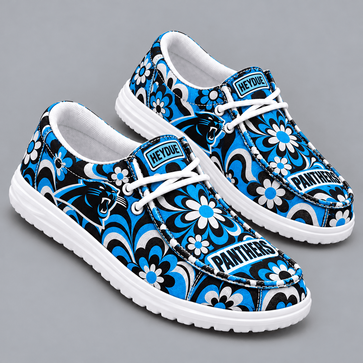 Carolina Panthers | Premium NFL Retro Groovy Floral Swirl Print HEYDUDE Casual Loafers With Team Logo And Lightweight Comfort Sole NDN cover