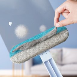 4-in-1 pet hair remover brush for Golden Retrievers – close-up of the brush head lifting dust and hair