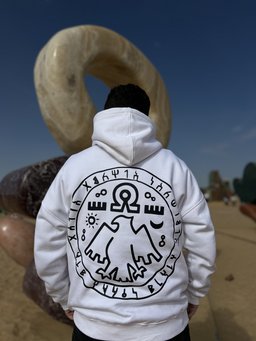 7 Eagles hoodie in white worn by a model – seven eagles seal print by QADIM