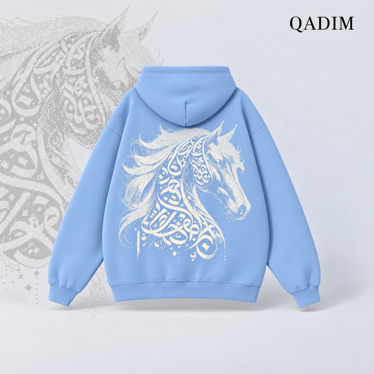 Jawad hoodie in baby blue – stippled Arabic calligraphy horse back print, Arabic calligraphy streetwear by QADIM
