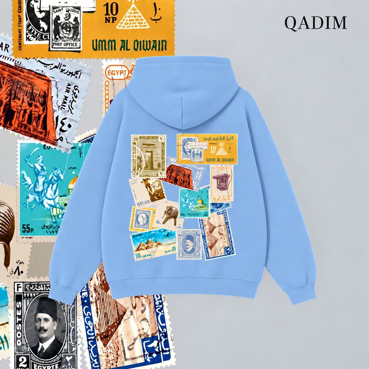 Tawabie hoodie in baby blue – vintage Egyptian postage stamp collage back print, Arabic calligraphy streetwear by QADIM