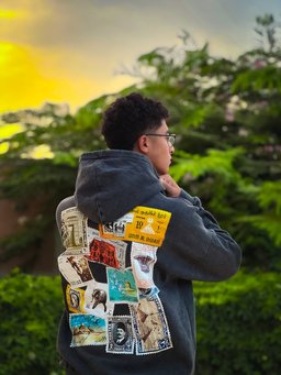 Tawabie hoodie styled in Egypt – vintage Egyptian postage stamp collage on the back (QADIM washed-black edition)