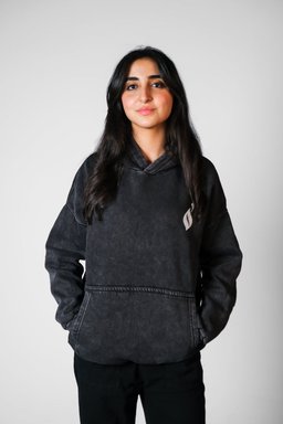 Tawabie hoodie styled in Egypt – vintage Egyptian postage stamp collage on the back (QADIM washed-black edition)