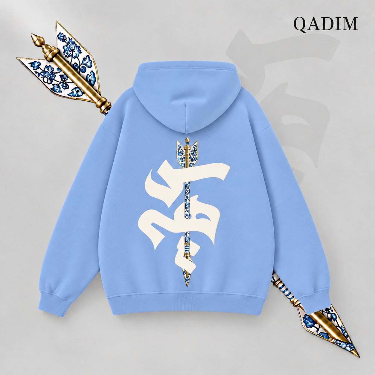 Sahm hoodie in baby blue – arrow in Arabic calligraphy back print, Arabic calligraphy streetwear by QADIM