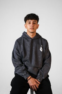 Sahm hoodie styled in Egypt – arrow in Arabic calligraphy on the back (QADIM washed-black edition)