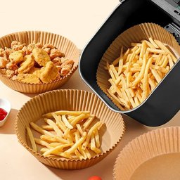 Air fryer basket lined with non-stick parchment paper