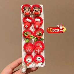 Close-up of Christmas hair ties for girls showing Santa Claus and reindeer details - Snapzon
