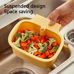 Space saving suspended sink filter basket mounted over kitchen sink