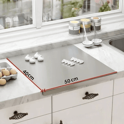 Stainless steel cutting board mounted on kitchen countertop with dimensions