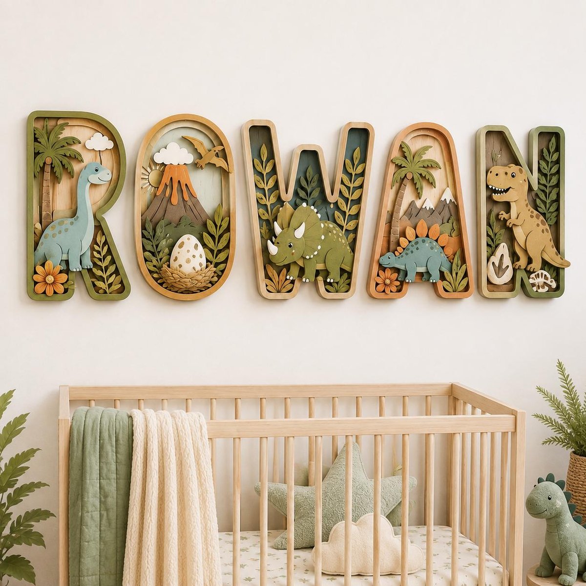 May include: Five layered wooden wall letters spelling ROWAN, each featuring a unique dinosaur theme. The letters include a long-necked dinosaur, a volcano with an egg, a triceratops, a stegosaurus, and a T-Rex, all decorated with palm trees and foliage.