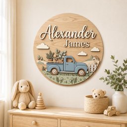 May include: A circular wooden wall sign featuring the name Alexander James in raised white lettering. The design includes a light blue pickup truck carrying potted plants, set against a landscape with white clouds, a small house, and a fence.