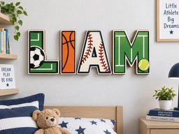 May include: A set of four large, three-dimensional wooden letters spelling the name LIAM. Each letter features a sports theme: the L is green with a soccer ball, the I is orange like a basketball, the A is white with red baseball stitching, and the M is green with a yellow tennis ball.
