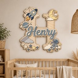 May include: A large wooden letter H wall decoration featuring space-themed cutouts including a rocket, a planet, a crescent moon, stars, clouds, and an astronaut. The name Henry is written in a blue script font across the center of the letter.
