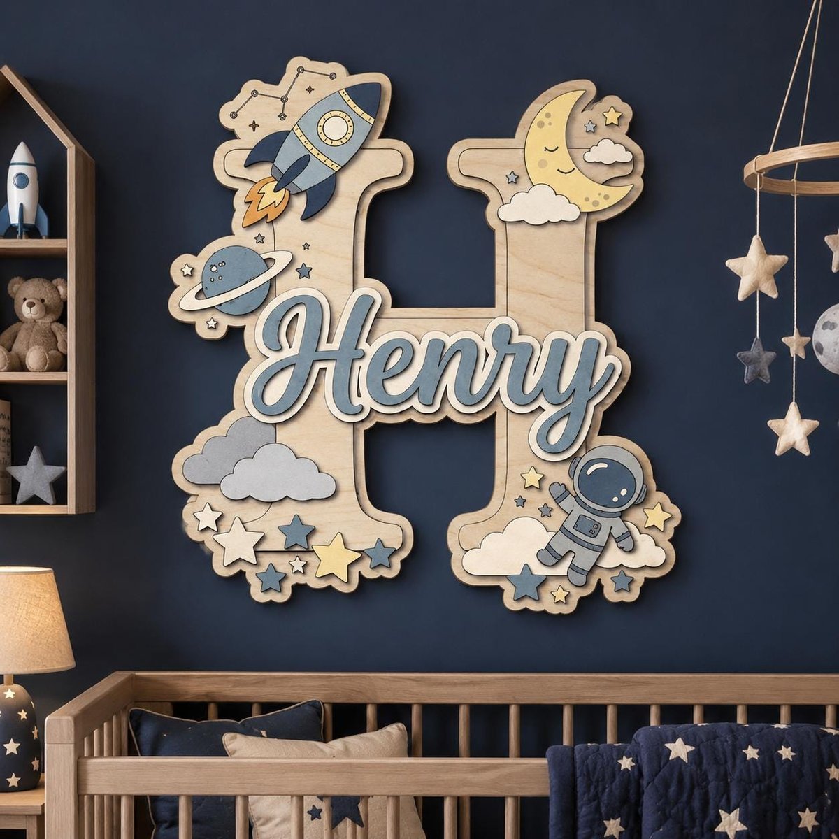 May include: A large wooden letter H wall decoration featuring space-themed cutouts including a rocket, planet, moon, clouds, stars, and an astronaut. The name Henry is written in blue script across the center of the letter in a layered design.