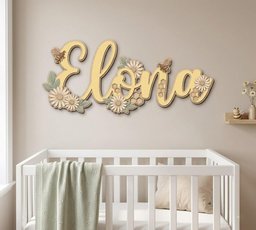 May include: A wooden wall sign featuring the name Elona in cursive script, decorated with layered daisies, sage green leaves, honeycombs, and small bees. The sign is finished in soft yellow, cream, and muted green tones, mounted above a white crib.