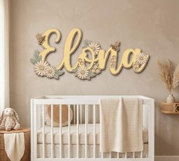 May include: A custom wooden wall sign featuring the name Elona in a cursive script, decorated with layered daisies, sage green leaves, small honeybees, and hexagonal honeycomb patterns in soft yellow, cream, and muted green tones.