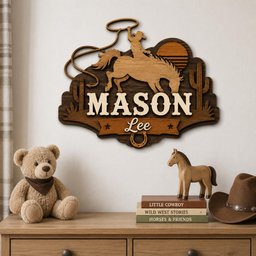 May include: A layered wooden wall sign featuring a cowboy on a bucking horse with a lasso, a sun, and cacti. The sign displays the name MASON in large white letters and the name Lee in script, with a horseshoe icon at the bottom center of the plaque.