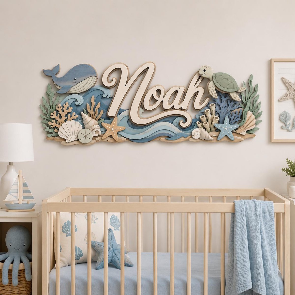 May include: A wooden wall sign featuring the name Noah in large script lettering, surrounded by layered ocean-themed cutouts including a blue whale, a green sea turtle, various seashells, starfish, coral, and stylized blue waves in shades of teal.