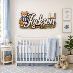 May include: A wall-mounted wooden sign featuring a cartoon bear wearing a blue jersey with the number 23 and holding a basketball. The sign displays the name Jackson in script lettering, accompanied by a soccer ball, football, and goal post.