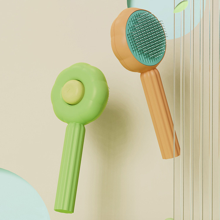 Green and orange style 2 grooming brush color options displayed together