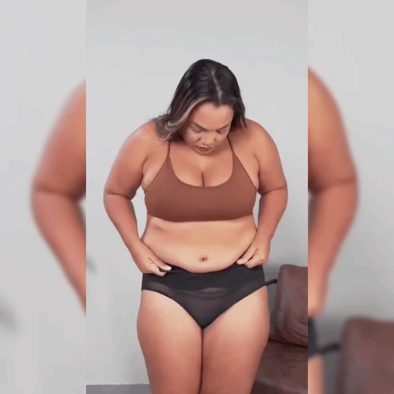 Sie zieht den Shape-Slip über den Bauch – sofort flach, vorne, seitlich und hinten